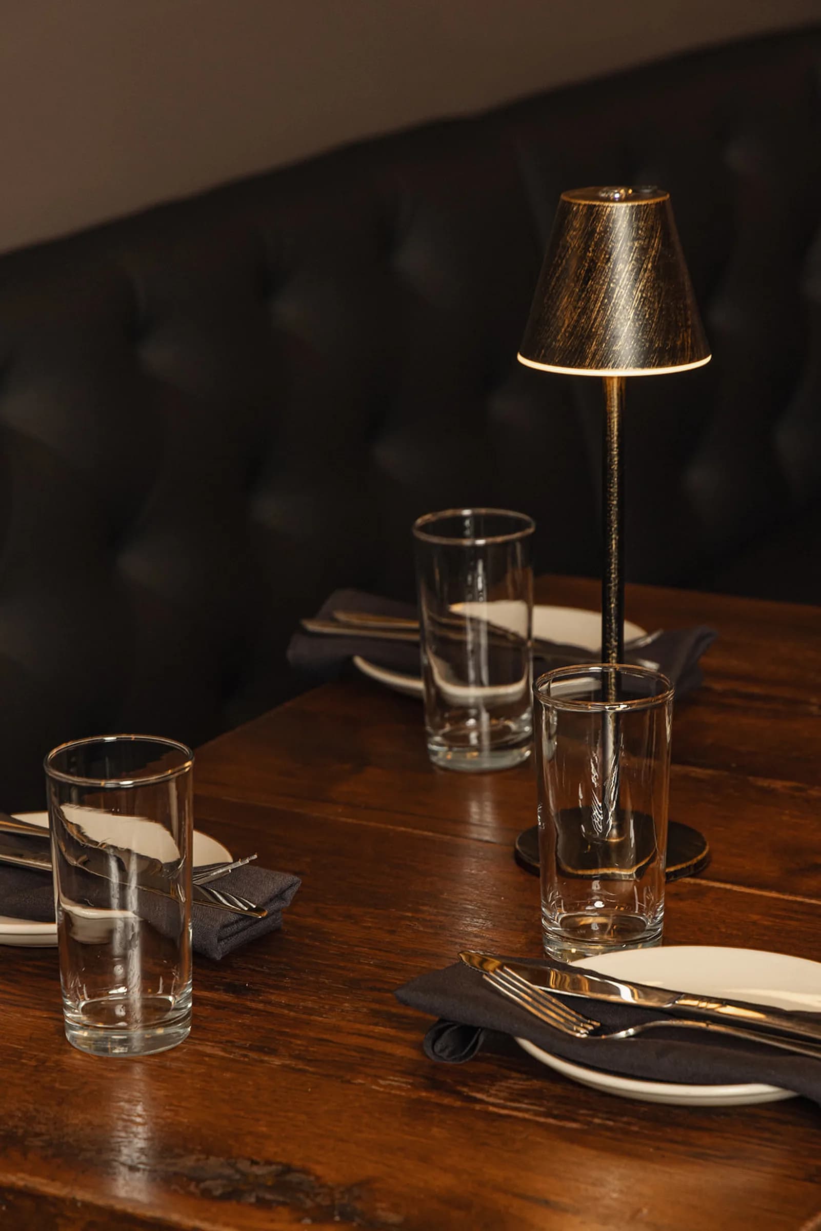 Booth table with lamp and place setting
